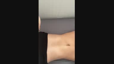 Laying half naked showing you my ass and piercing