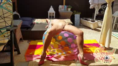 Dildoplay on a huge beachball