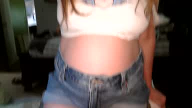 pregnant in shorts and cut-off shirt