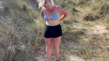 Naked in sand dunes