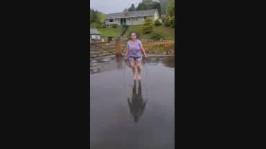 Tits bouncing skipping in rain