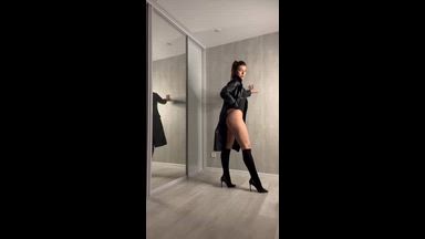 in a leather coat