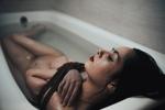 naked shibari in a bathroom