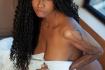 Sexy ebony between white sheets