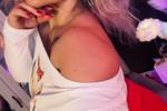 White top, no bra.Red shorts.Nude nylons.stilettos