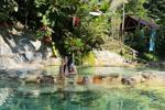 A beautiful nude in a natural pool
