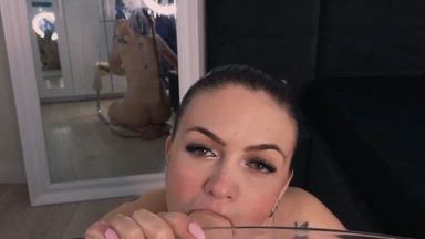 Blowing the dildo