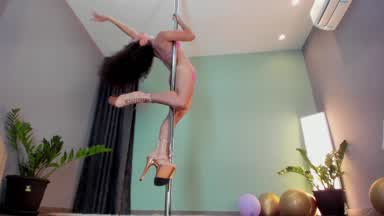 Exotic pole dance with high heels