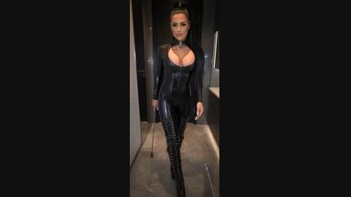 Glossy latex catsuit tease