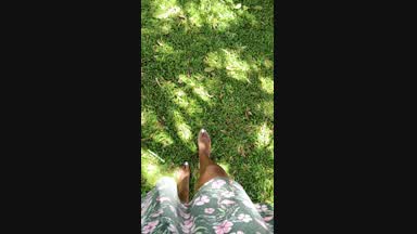 alika feet in the grass