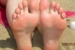 beach feet in the sand