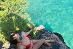 Red bikini on the rocks