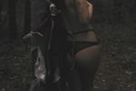 Naughty Halloween in forest. sexy nun