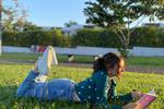 naugthy reading in the park