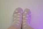 stella — feet in fuzzy socks