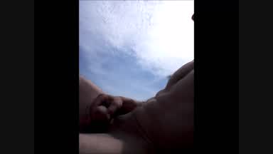 Cumshow on nude beach