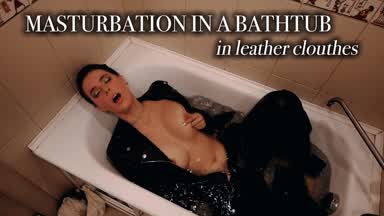 MASTURBATION IN A BATHTUB IN LEATHER CLOTHES