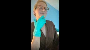 Green medical gloves breast exam/play