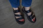 My feet in sandals with red nail polish - Lina