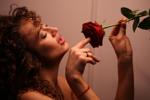 Eve seductively devours a rose
