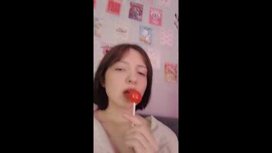 licking a lollipop