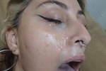 Isis with her face covered in cum