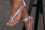 White ribbons & pointed feet