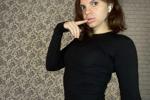 in a tight-fitting black turtleneck