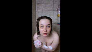 drops of water on a naked body, foam spreads